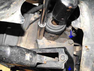 Remove the bracket that holds transfer case shifter