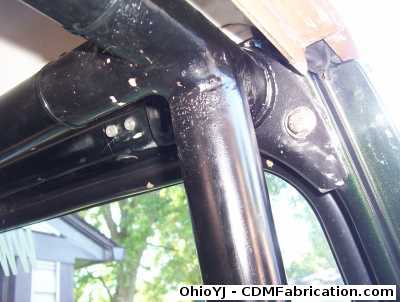 Remove upper roll cage bolts