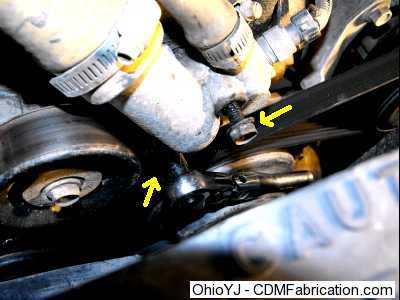 Remove the bolts from the thermostat housing