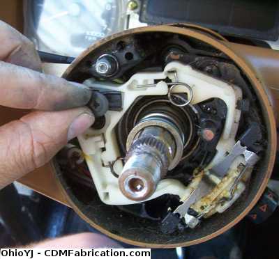 Remove the phillips head screw from the turn signal lever