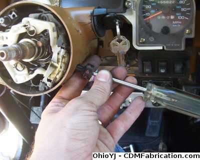Remove the screw that hold the hazzard knob in