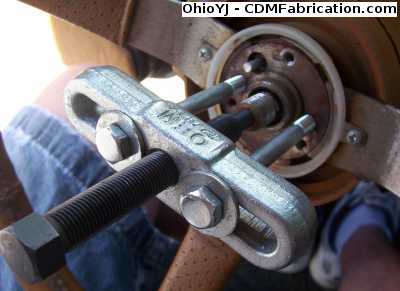 Use a steering wheel puller